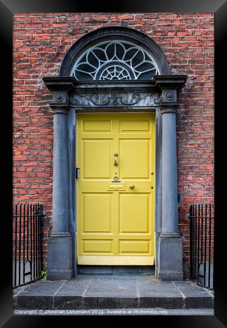 yellow door of georgian house in Kilkenny Framed Print by Christian Lademann