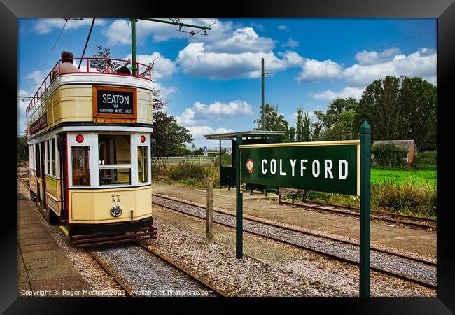 Electric Tram Arriving at Colyford Station Framed Print by Roger Mechan