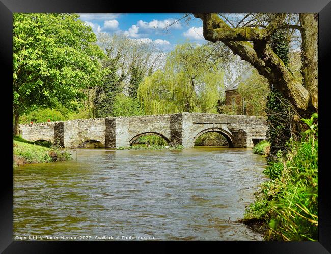 Ancient Stone Bridge Amidst a Flood Framed Print by Roger Mechan