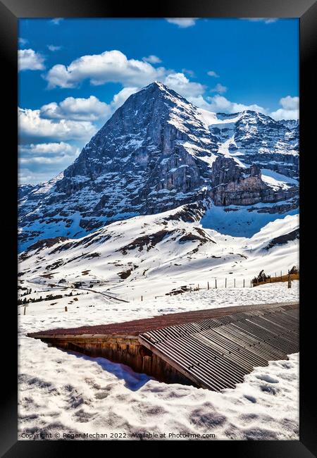 The Chilling Beauty of Eiger's North Face Framed Print by Roger Mechan
