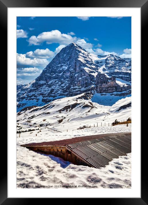 The Chilling Beauty of Eiger's North Face Framed Mounted Print by Roger Mechan
