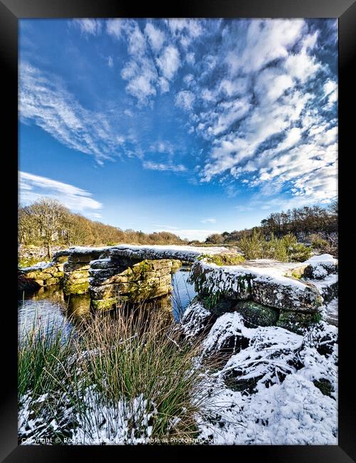 Dartmoor clapper bridge in the snow Framed Print by Roger Mechan