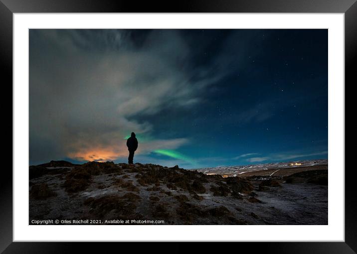 Exploring night time Iceland Northern Lights. Framed Mounted Print by Giles Rocholl