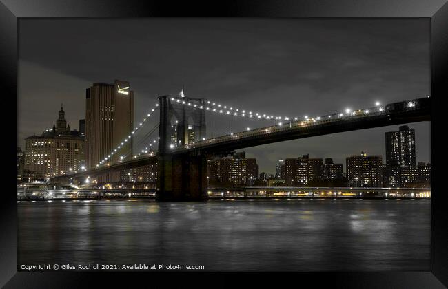Brooklyn Bridge New York night time. Framed Print by Giles Rocholl