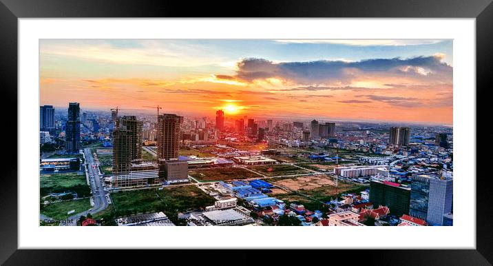 The sun sets over Phnom Penh... Framed Mounted Print by Arnaud Jacobs