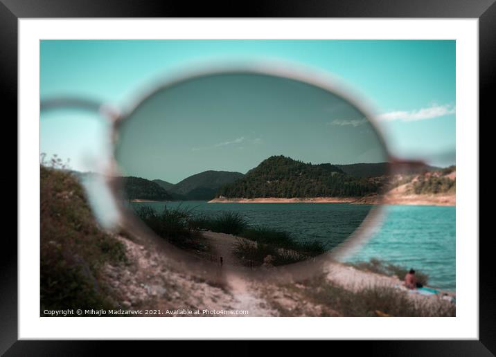 Focus view of mountain nature and a lake through s Framed Mounted Print by Mihajlo Madzarevic