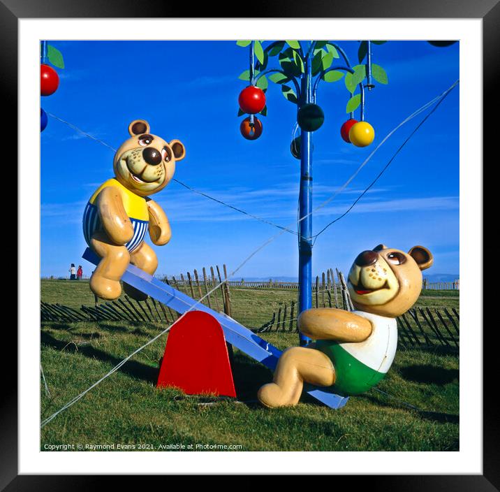 Teddy Bears picnic see saw Framed Mounted Print by Raymond Evans