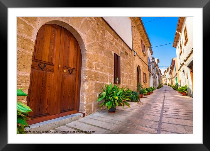 Street with potted plants in Alcudia old town Framed Mounted Print by Alex Winter