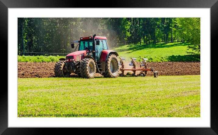 Tractor plowing a field Framed Mounted Print by Alex Winter