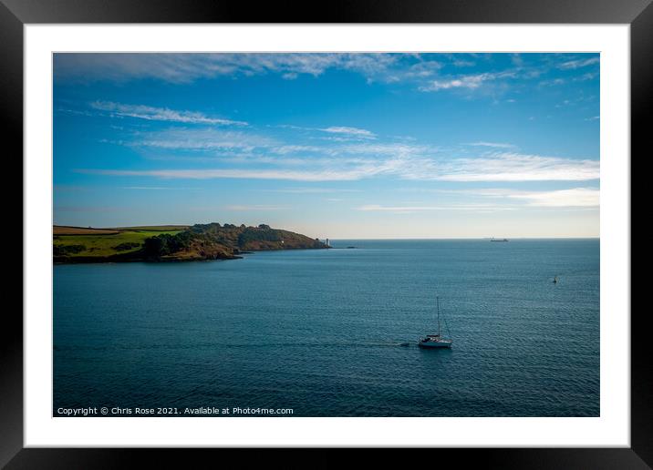 A sailing boat passes St Anthony Head Framed Mounted Print by Chris Rose