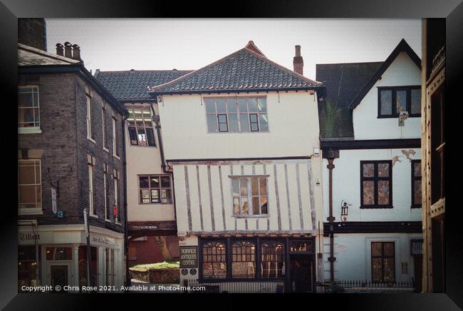 Norwich, Crooked old half-timbered building Framed Print by Chris Rose