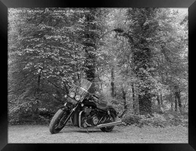A Triumph Thunderbird Storm motorcycle parked beneath trees on a sunny day, in mono Framed Print by Mark Rosher