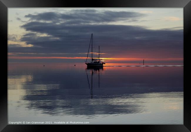 Yacht caught in the sunset Framed Print by Ian Cramman