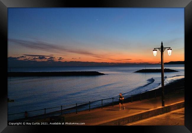 Sidmouth Evening Runner Framed Print by Roy Curtis