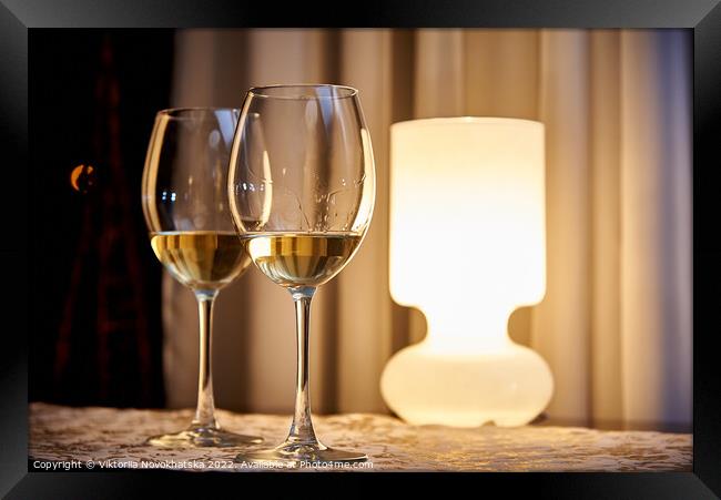 Two glasses of white wine Framed Print by Viktoriia Novokhatska