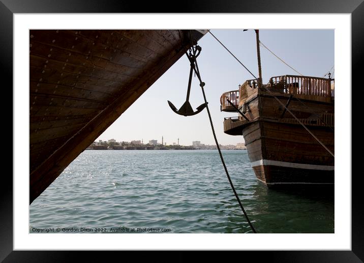 Cargo dhow bows and anchor, moored in Dubai creek UAE Framed Mounted Print by Gordon Dixon