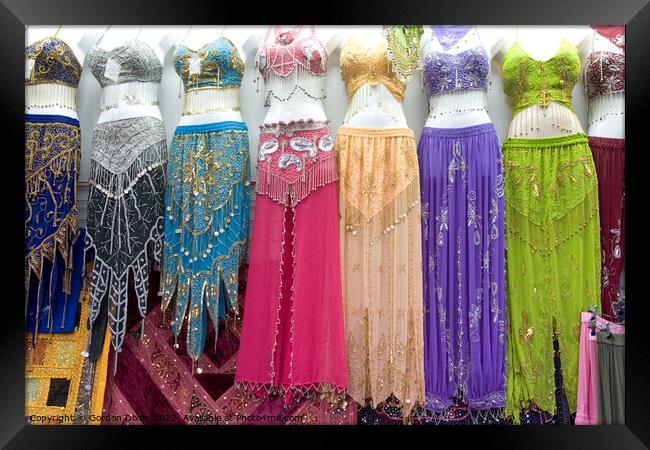 Belly dancer's dresses for sale in the cloth souk, Bur Dubai, UAE Framed Print by Gordon Dixon