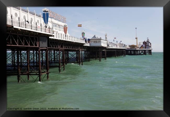 Brighton Pier at high tide Framed Print by Gordon Dixon