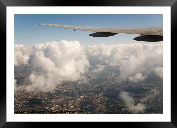 High above London, onroute to Heathrow with London and the Thames below Framed Mounted Print by Gordon Dixon