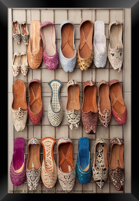 Arabian slippers for sale at a Dubai souk Framed Print by Gordon Dixon