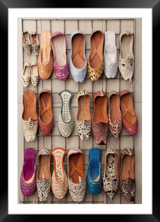 Arabian slippers for sale at a Dubai souk Framed Mounted Print by Gordon Dixon