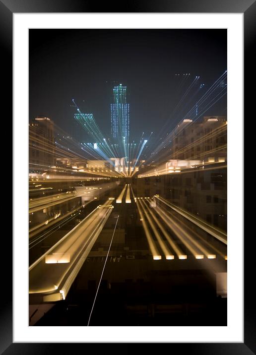 Zoomed image of skyscrapers at night in Dubai Framed Mounted Print by Gordon Dixon