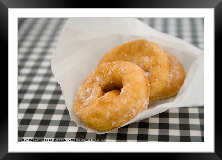 Freshly made doughnuts bought from a kiosk at West Bay, Dorset Framed Mounted Print by Gordon Dixon