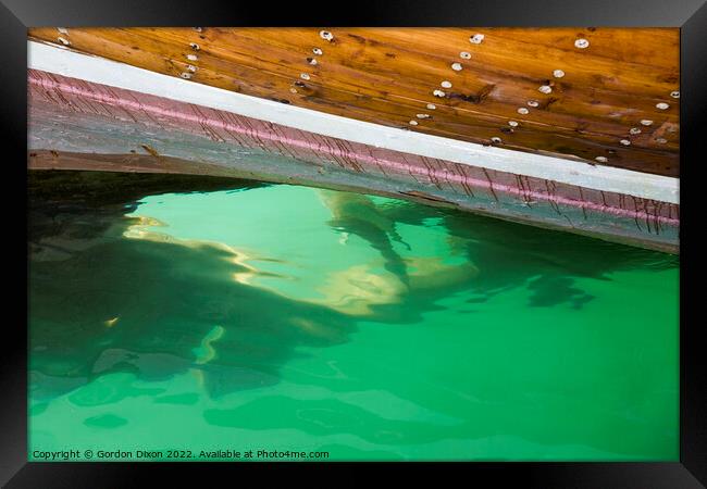 Submerged propeller of a cargo dhow in Dubai creek Framed Print by Gordon Dixon