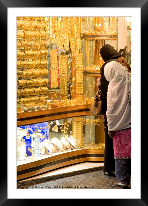 2 ladies shop for gold in the Dubai gold souk Framed Mounted Print by Gordon Dixon