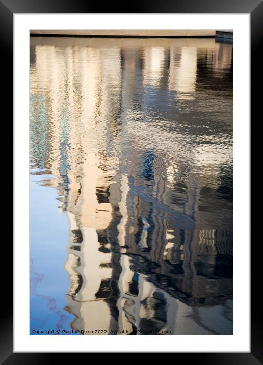 New buildings around the Burj Khalifa in Dubai, reflected in a lake Framed Mounted Print by Gordon Dixon