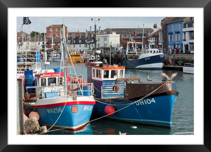 Trawlers home in a bustling Weymouth harbour Framed Mounted Print by Gordon Dixon