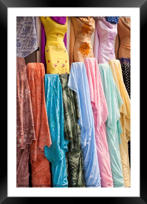 Colourful Arabian Ladies clothing - Dubai Framed Mounted Print by Gordon Dixon