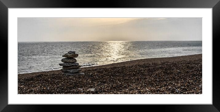 Tranquil beach with stone sculpture and sun on water (watercolour)  - Dorset Framed Mounted Print by Gordon Dixon