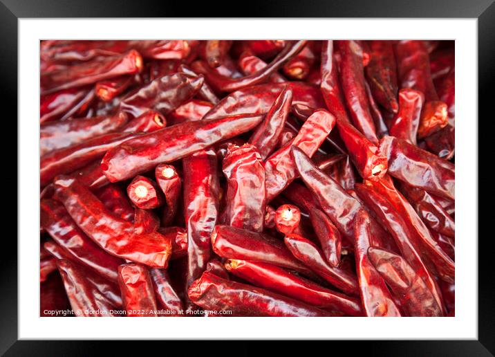 Shiny red dried chillies for sale on a market stall in Seoul, South Korea  Framed Mounted Print by Gordon Dixon