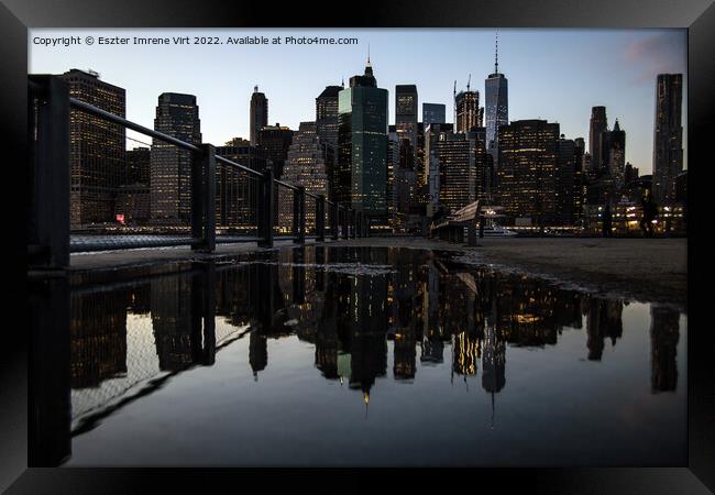 Reflection of the skyline of Manhattan at night Framed Print by Eszter Imrene Virt