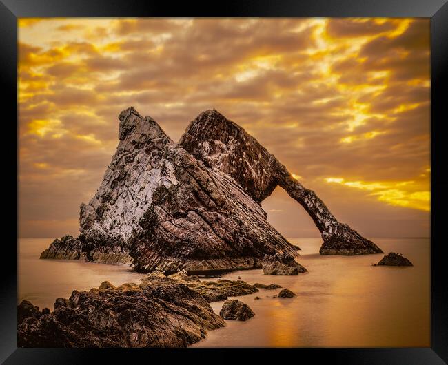 Sunrise at Bow Fiddle Rock in Scotland Framed Print by DAVID FRANCIS