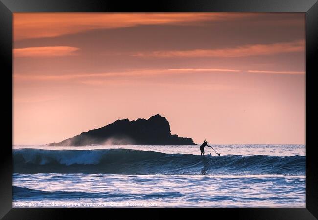 Evening light over a Stand Up Paddleboarder paddli Framed Print by Gordon Scammell