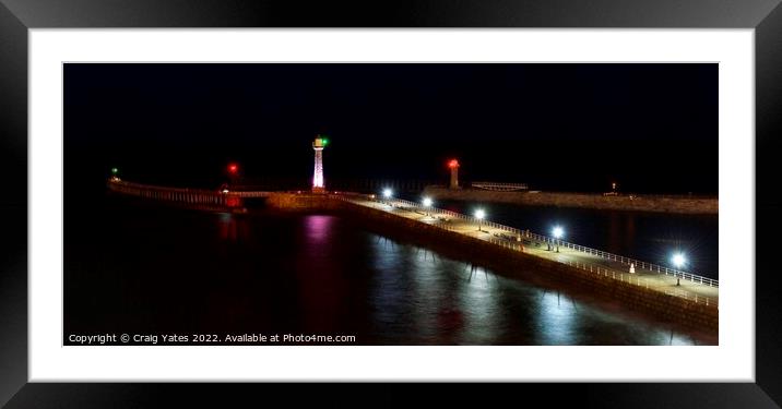 Whitby Lighthouse and Pier Night Shot. Framed Mounted Print by Craig Yates
