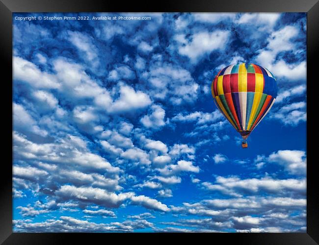A colorful ballon flying in the sky Framed Print by Stephen Pimm