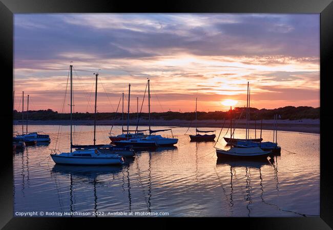 Serene Sunset Yachts Framed Print by Rodney Hutchinson