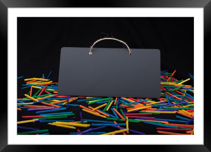 Rectangular shaped black notice board on colorful sticks  Framed Mounted Print by Turgay Koca