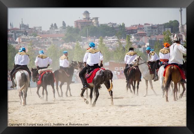 Horseman riding in their ethnic clothes on horse   Framed Print by Turgay Koca