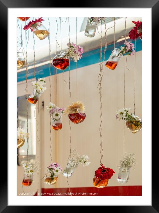 Herbal tea bottles hanging on strings Framed Mounted Print by Turgay Koca