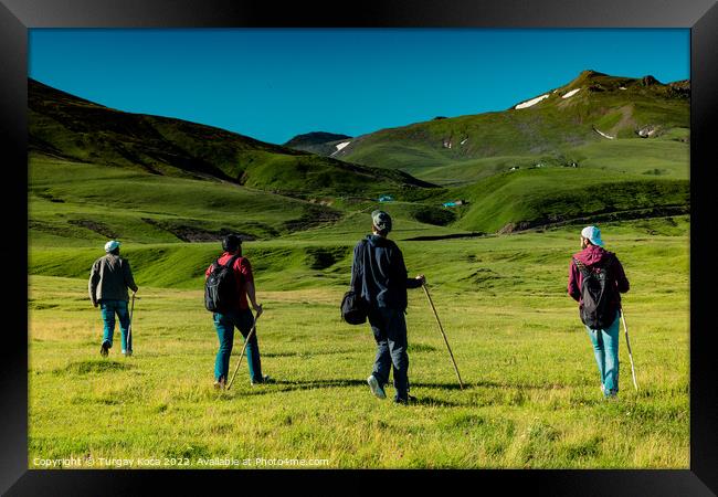 hikers with backpacks and trekking poles walking in Artvin highl Framed Print by Turgay Koca
