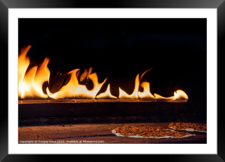 The flames beside a pancake with spicy meat filling Framed Mounted Print by Turgay Koca