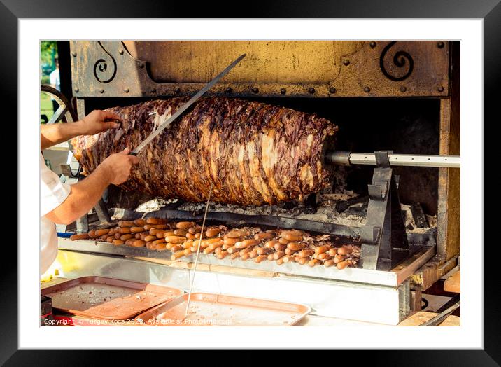Chef cutting Turkish Cag Kebab in display Framed Mounted Print by Turgay Koca