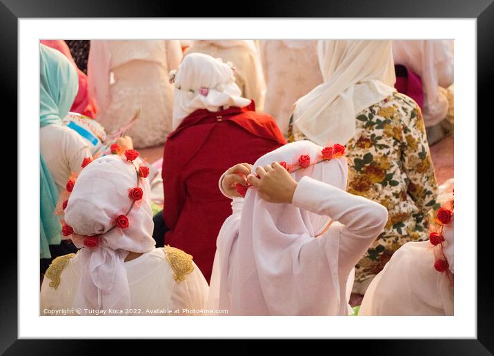 Girls with hijab in a big mosque Framed Mounted Print by Turgay Koca