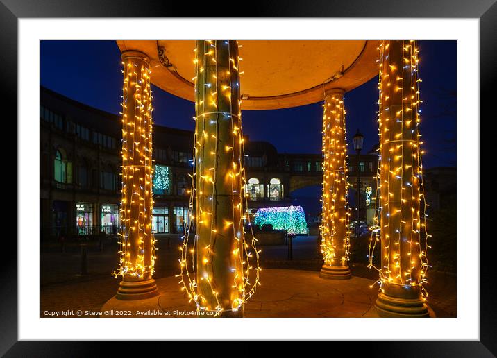 Sparkling Festive Lights Decorating Four Pillars.  Framed Mounted Print by Steve Gill