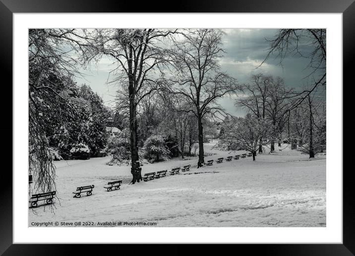 Row of Seats Along a Snow Covered Park on a wintry January morning.  Framed Mounted Print by Steve Gill