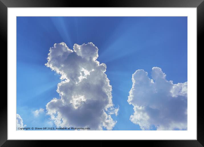 White and Grey Clouds with Sunrays Shining Through. Framed Mounted Print by Steve Gill